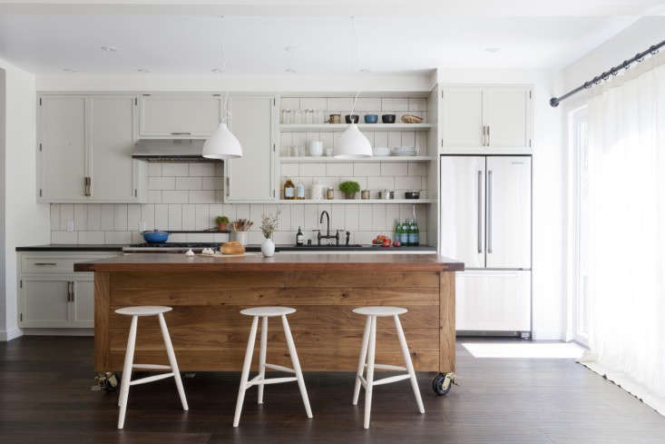 a venice, california, kitchen by simo design features a wood topped island 16